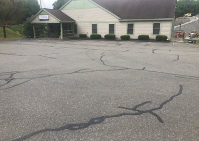 Crack sealing a commercial parking lot
