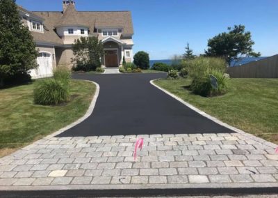 Crack sealing and paving at a residential driveway