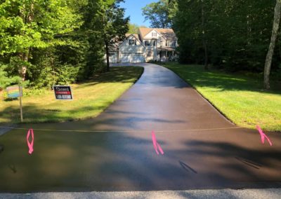 Residential driveway sealcoating