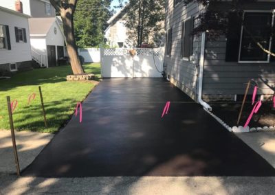 Residential driveway sealcoating